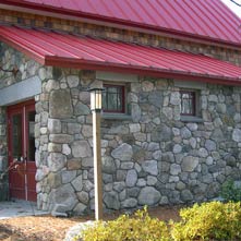A milking parlor with fieldstone veneer, granite lintels & bluestone window sills